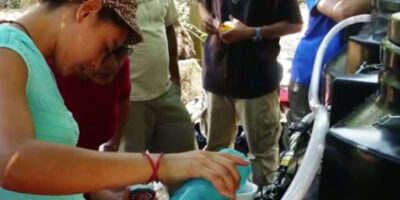 Woman using a chlorinating machine